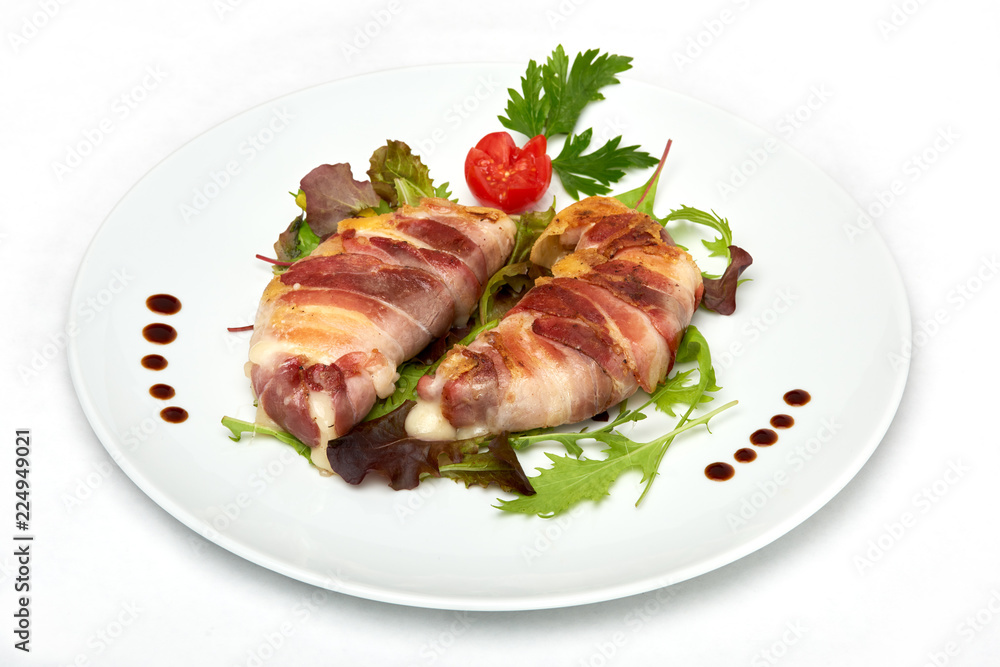 Italian food, Grilled provolone cheese with smoked panceta, served on white plate, isolated on white background Italian food, Grilled provolone cheese with smoked panceta, served on white plate, isolated on white background