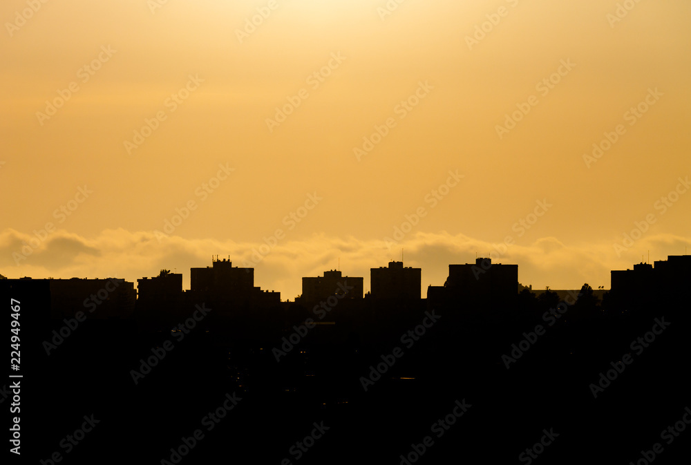 Silhouetted Building Tops at Sunset