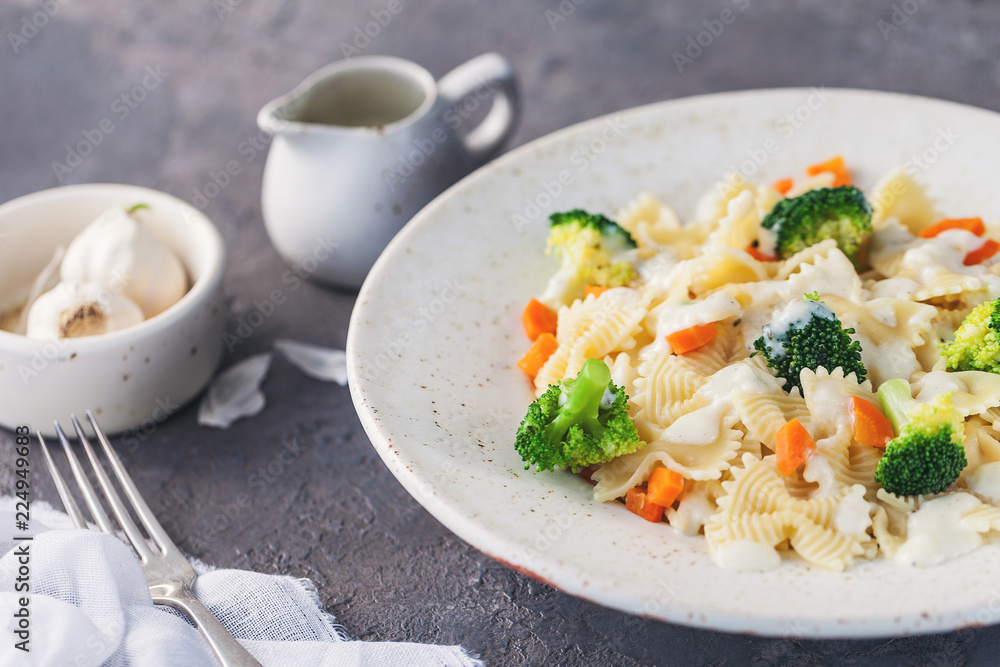 Homemade farfalle with with broccoli and carrots, bechamel Homemade farfalle with with broccoli and carrots, bechamel