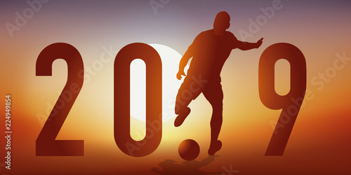 Carte de vœux 2019 sur le thème du football, avec un footballeur en pleine action, qui tire pour marquer un but