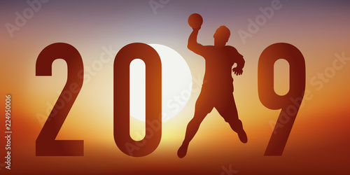 Carte de vœux 2019 sur le thème du handball, avec un handballeur en pleine action, qui tire en extention pour un tir au but