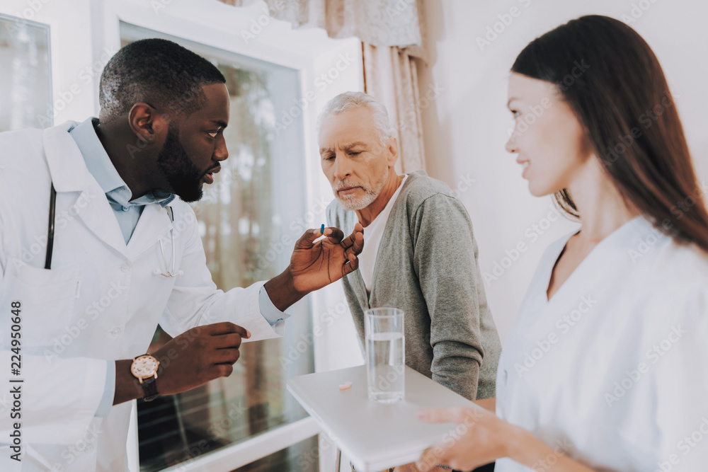 Fototapeta premium Patient with Walker. Take Pills. Very Focused.