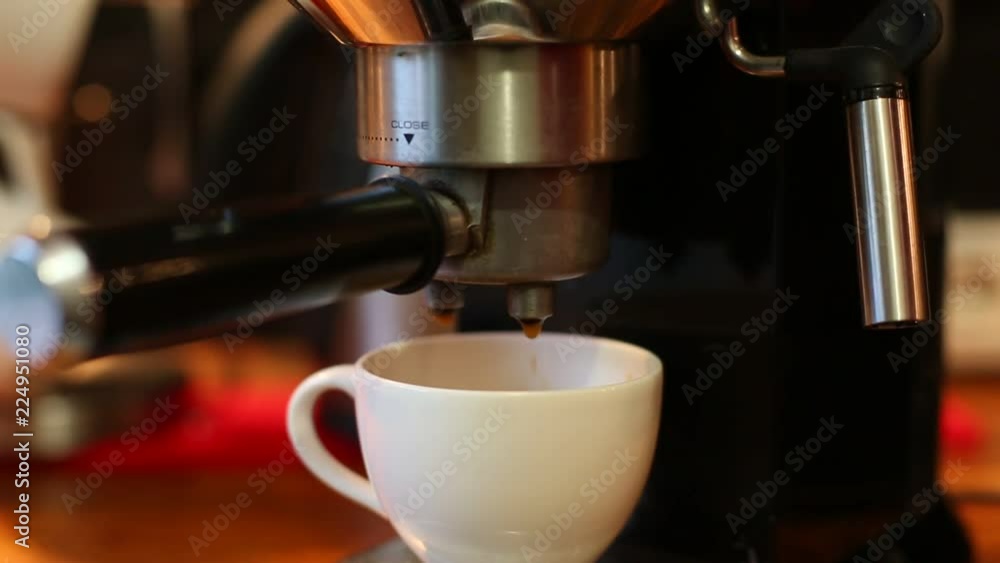 insert the Holder from the coffee into the coffee machine close up insert the Holder from the coffee into the coffee machine close up