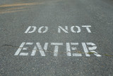 do not enter panted type on black tarmac street