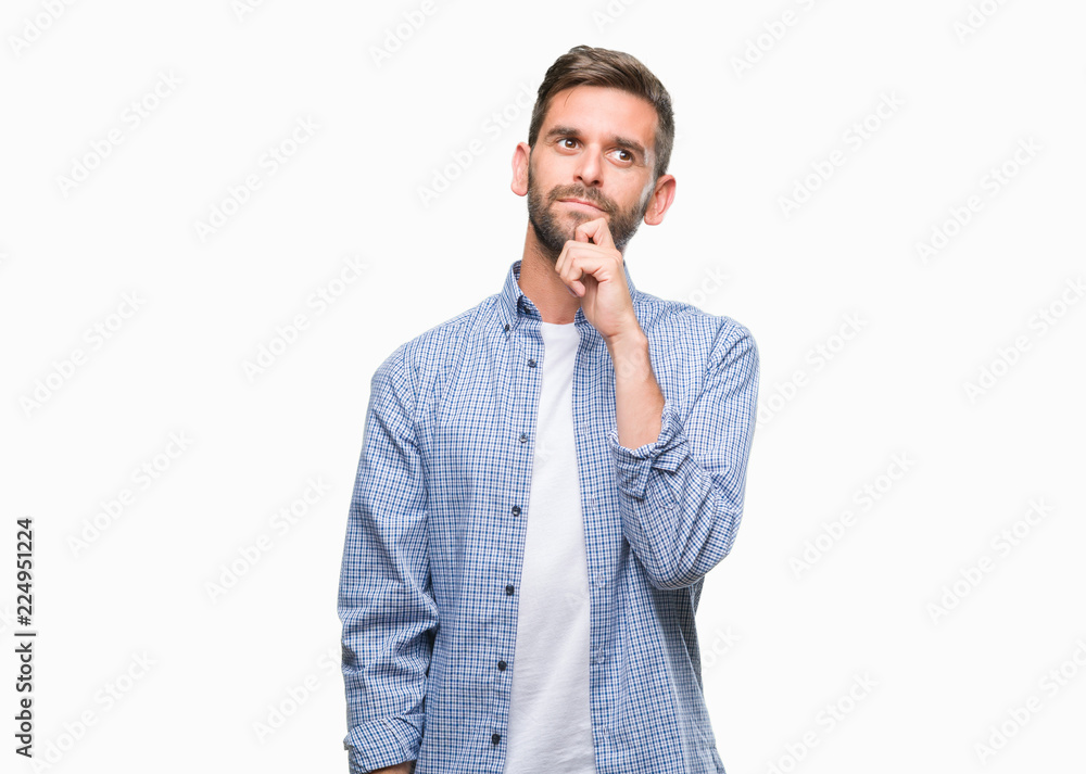 Young handsome man wearing white t-shirt over isolated background with hand on chin thinking about question, pensive expression. Smiling with thoughtful face. Doubt concept. Young handsome man wearing white t-shirt over isolated background with hand on chin thinking about question, pensive expression. Smiling with thoughtful face. Doubt concept.