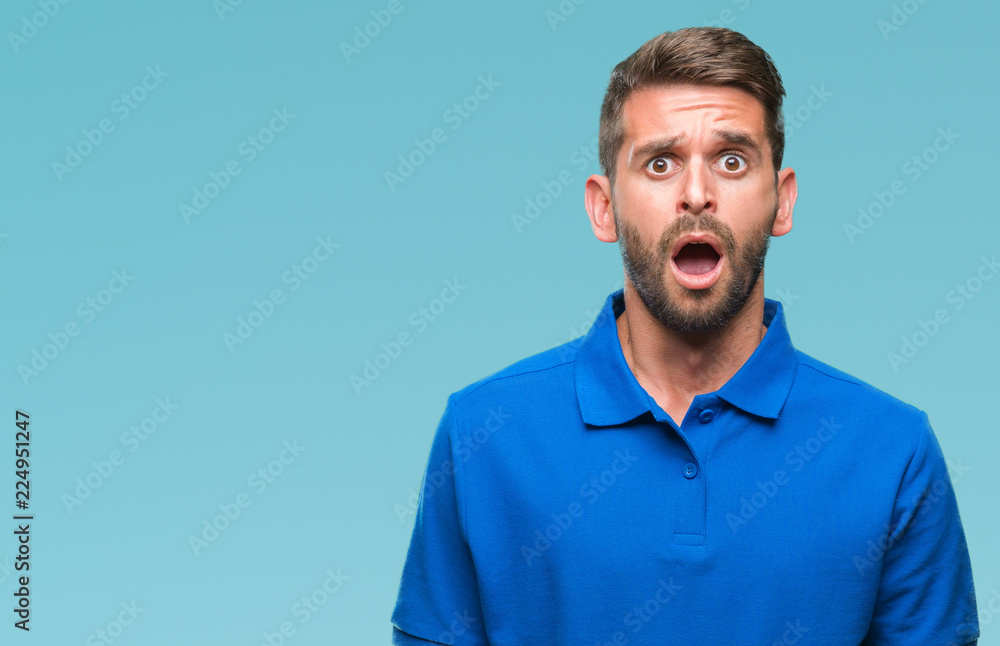 Young handsome man over isolated background afraid and shocked with surprise expression, fear and excited face. Young handsome man over isolated background afraid and shocked with surprise expression, fear and excited face.