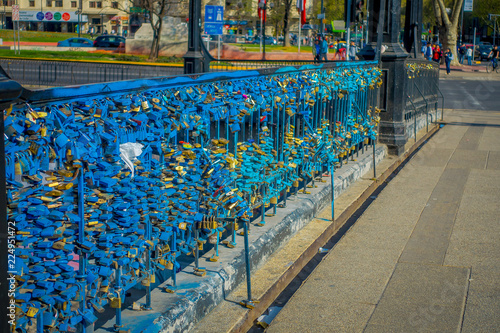 Outdoor view in a row of love locks padlocks chained to footbridge over the river mapocho providencia Santiago Chile © Fotos 593