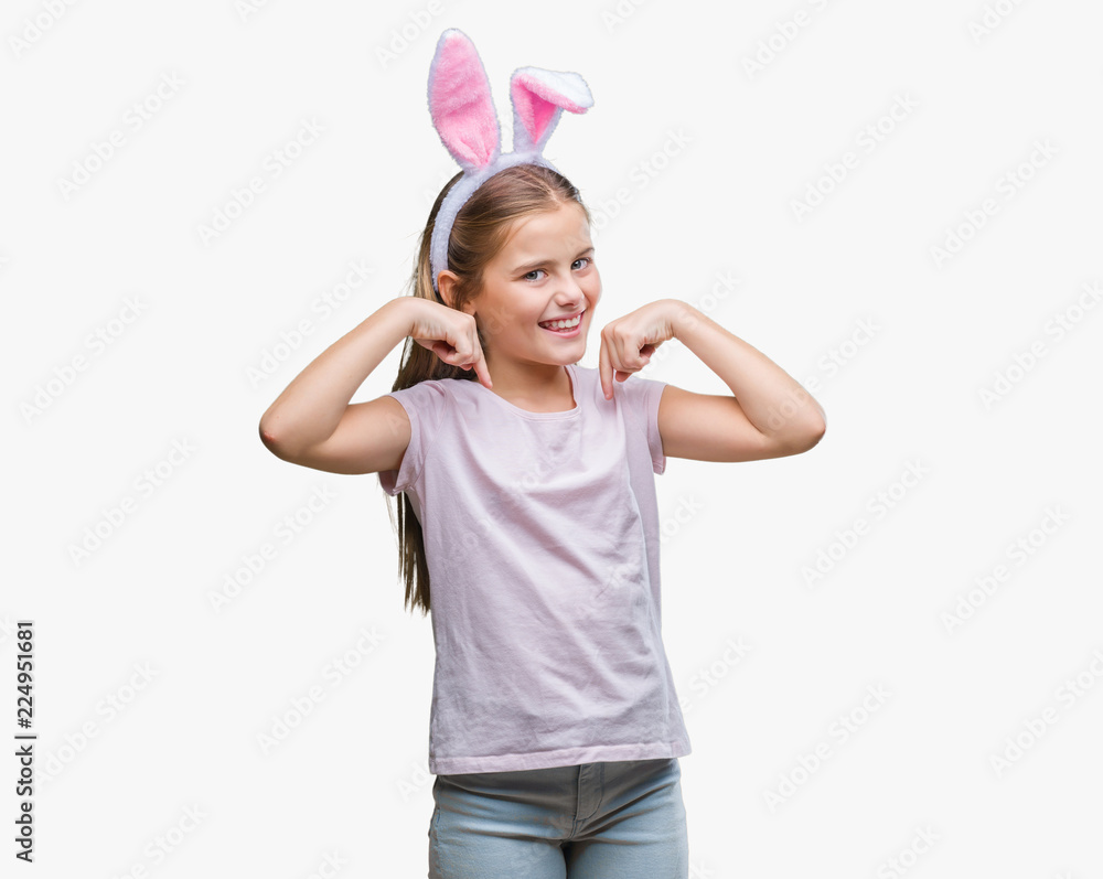 Young beautiful girl wearing easter bunny ears over isolated background looking confident with smile on face, pointing oneself with fingers proud and happy. Young beautiful girl wearing easter bunny ears over isolated background looking confident with smile on face, pointing oneself with fingers proud and happy.