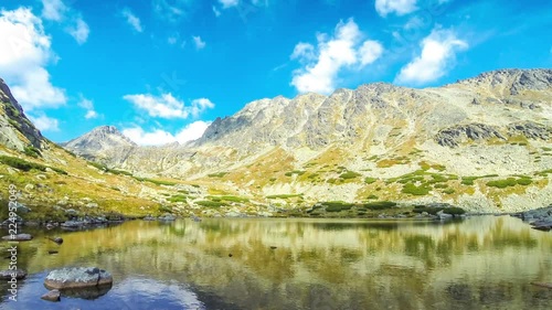 Hiking in High Tatras Mountains, Slovakia. Lake over Skok waterfall (Slovak: Pleso nad Skokom) (1801m). Mounts Satan (2421m), Predna Basta (2374m), Mala Basta (2288m) on the background. Time Lapse