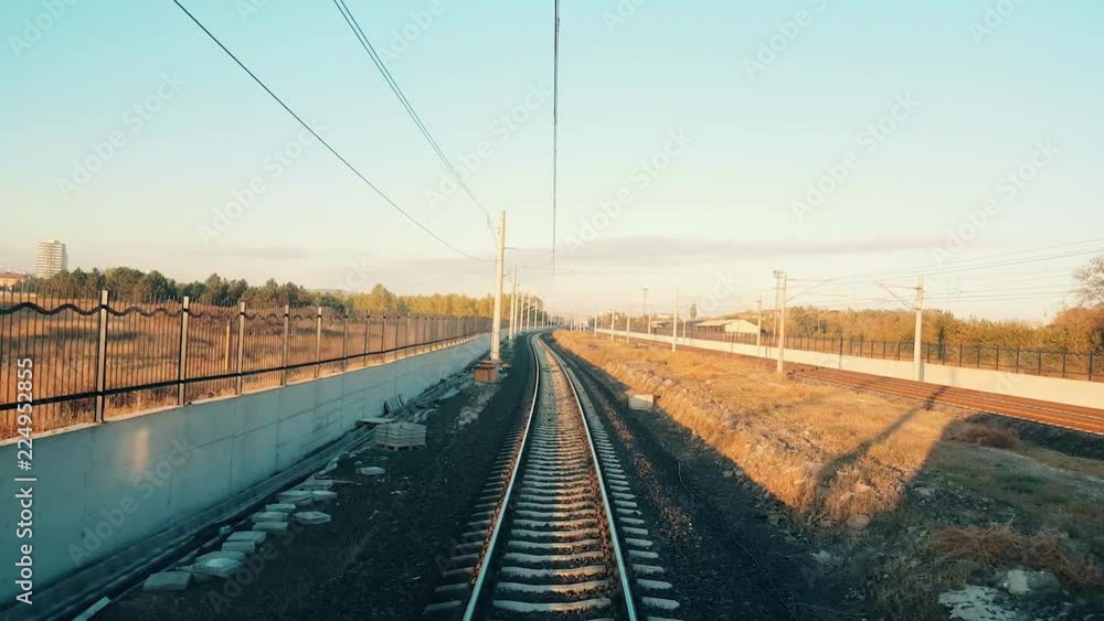 Train approaching to the station in Eskisehir in a beautiful sunny morning, view from the rear of train Train approaching to the station in Eskisehir in a beautiful sunny morning, view from the rear of train