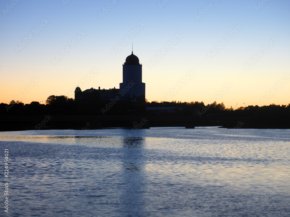 Medieval Swedish fortress castle on the sunset background in Vyborg, Russia. Saint Olav tower. The first record of the castle dates back to 1293