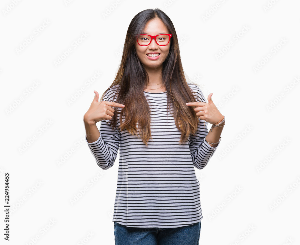 Young asian woman wearing glasses over isolated background looking confident with smile on face, pointing oneself with fingers proud and happy. Young asian woman wearing glasses over isolated background looking confident with smile on face, pointing oneself with fingers proud and happy.
