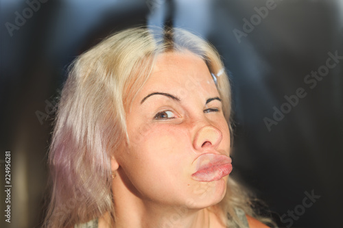 female face pressed against glass or window