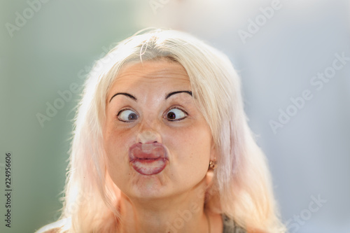 female face pressed against glass or window