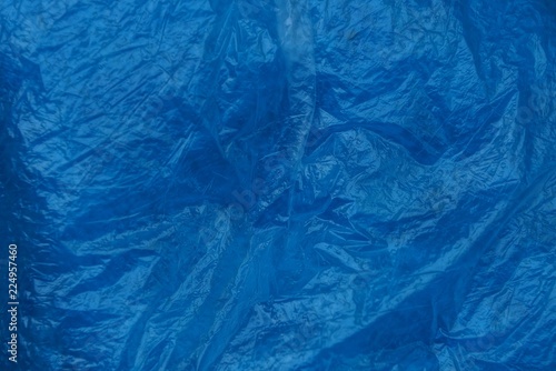 blue plastic texture of crumpled piece of cellophane