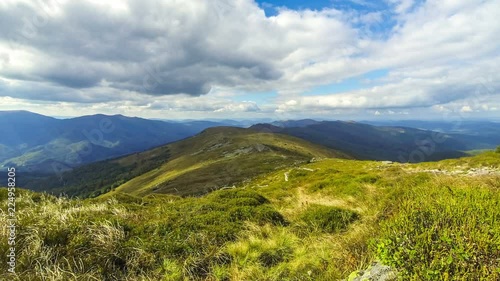 Picturesque landscape of Carpathian mountains in early autumn. View from mount Pikui (1405m). Mount Zelemenyi (1304m) on the background. Carpathians, Ukraine. Time Lapse. 4K UltraHD photo