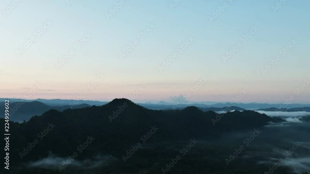 Landscape of Morning Mist with Mountain Layer at north of Thailand. Aerial View. Flying over the high mountains in beautiful clouds . Aerial video shot. Landscape of Morning Mist with Mountain Layer at north of Thailand. Aerial View. Flying over the high mountains in beautiful clouds . Aerial video shot.