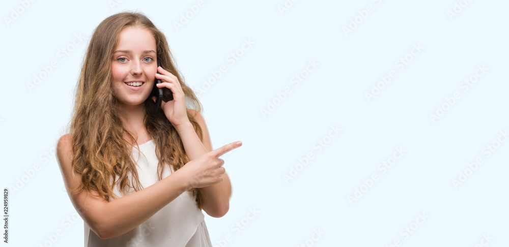 Young blonde woman using smartphone very happy pointing with hand and finger to the side Young blonde woman using smartphone very happy pointing with hand and finger to the side