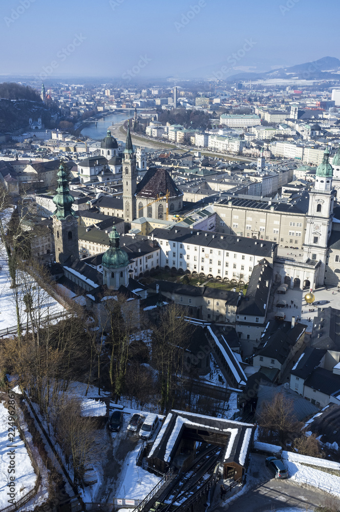 View over Salzburg with snow covered park and Cathedral in foreground View over Salzburg with snow covered park and Cathedral in foreground