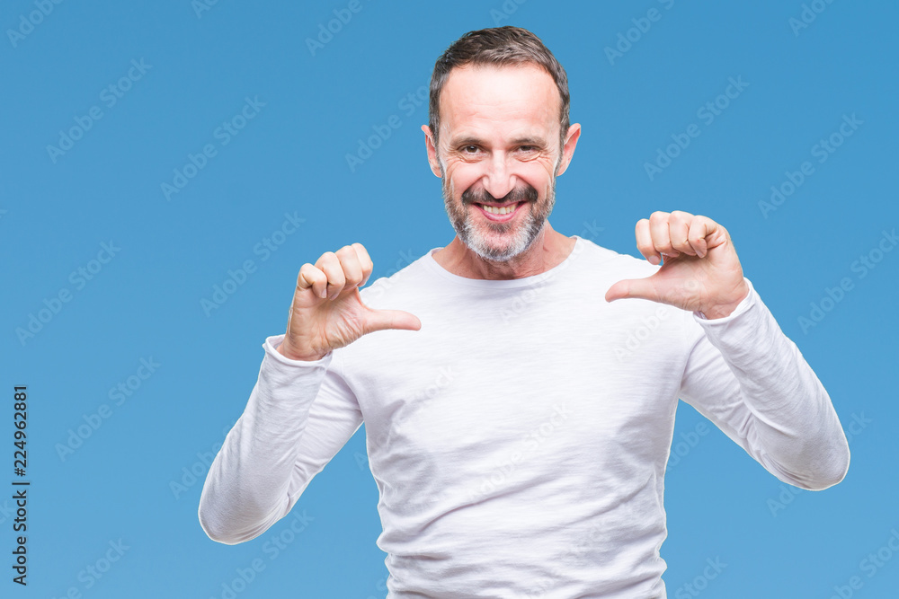 Fototapeta premium Middle age hoary senior man wearing white t-shirt over isolated background looking confident with smile on face, pointing oneself with fingers proud and happy.