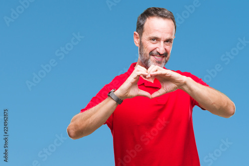Middle age hoary senior man over isolated background smiling in love showing heart symbol and shape with hands. Romantic concept.
