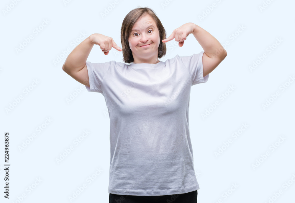 Young adult woman with down syndrome over isolated background smiling confident showing and pointing with fingers teeth and mouth. Health concept. Young adult woman with down syndrome over isolated background smiling confident showing and pointing with fingers teeth and mouth. Health concept.