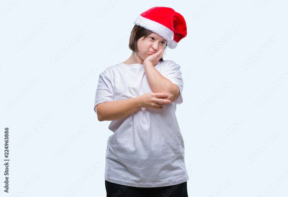 Young adult woman with down syndrome wearing christmas hat over isolated background thinking looking tired and bored with depression problems with crossed arms. Young adult woman with down syndrome wearing christmas hat over isolated background thinking looking tired and bored with depression problems with crossed arms.