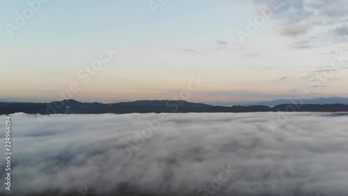Wallpaper Mural Landscape of Morning Mist with Mountain Layer at  north of Thailand. Aerial View. Flying over the high mountains in beautiful clouds . Aerial video shot. Torontodigital.ca