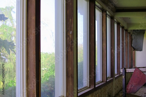 Broken window panes in an abandoned building