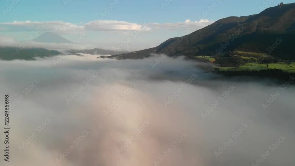 Flying above the clouds at lake Ashi and looking at mount Fuji, Hakone, Japan Flying above the clouds at lake Ashi and looking at mount Fuji, Hakone, Japan