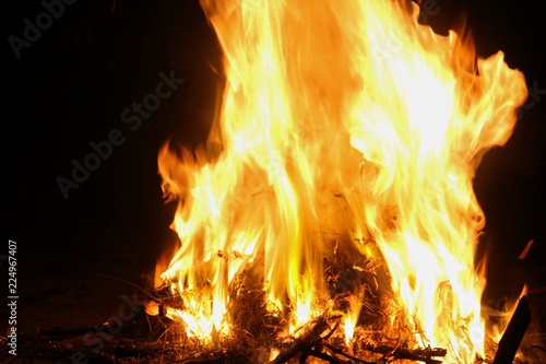 Hot yellow flames from a bonfire