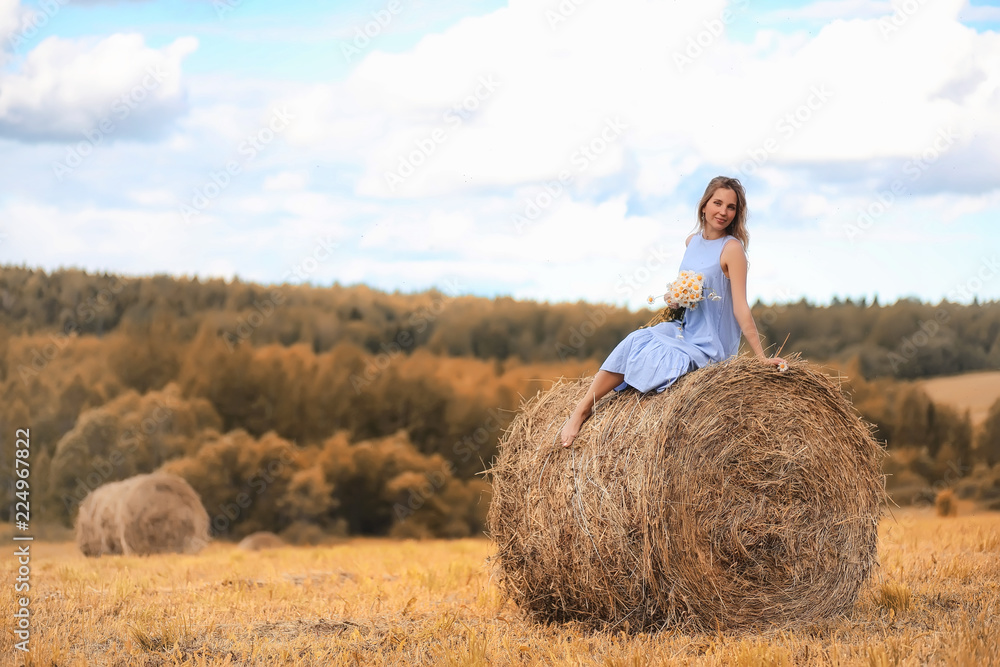 Two girls in dresses in autumn field Two girls in dresses in autumn field