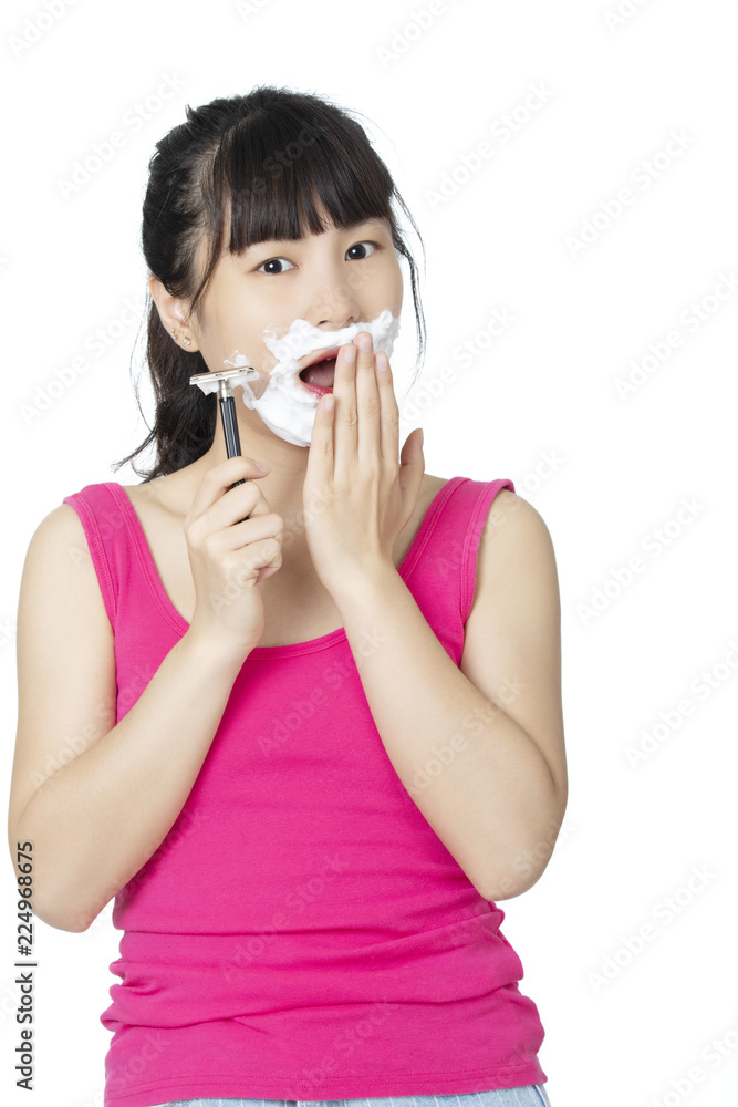 Chinese woman shaving isolated on a white background Chinese woman shaving isolated on a white background