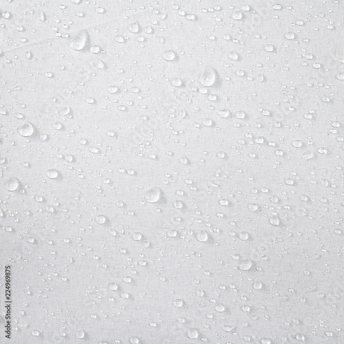 Fotografie Water drops on waterproof fabric background