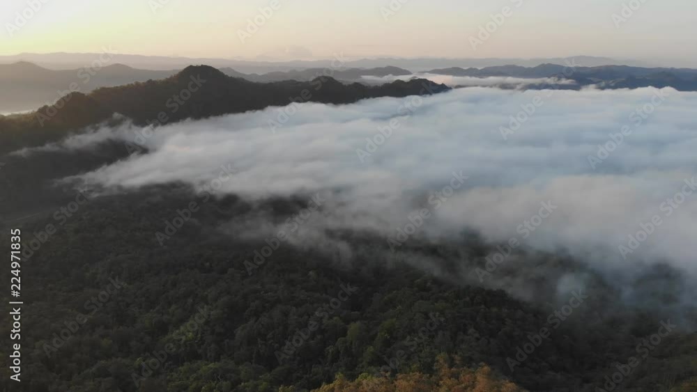 Landscape of Morning Mist with Mountain Layer at north of Thailand. Aerial View. Flying over the high mountains in beautiful clouds . Aerial video shot. Landscape of Morning Mist with Mountain Layer at north of Thailand. Aerial View. Flying over the high mountains in beautiful clouds . Aerial video shot.