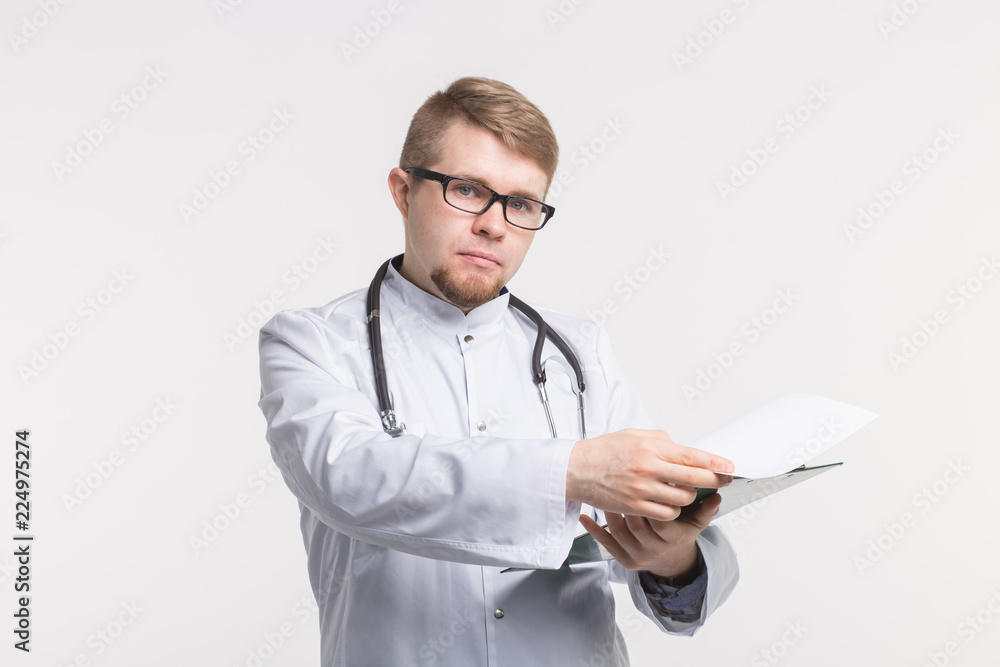 Doctor with stethoscope, holding the document folder on white background Doctor with stethoscope, holding the document folder on white background