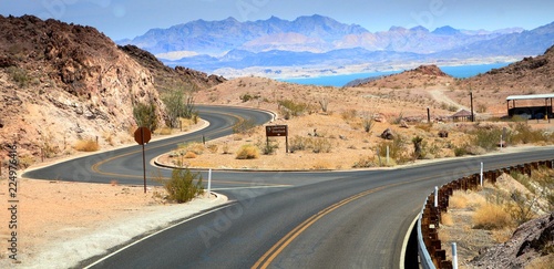 Twisting roads and intersection on the road to Hoover Dam in Boulder City, with Lake Mead in the background.