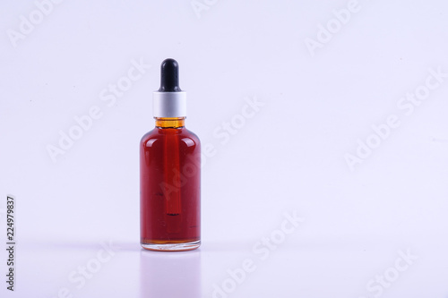 Nigella sativa or Black cumin oil over white background.