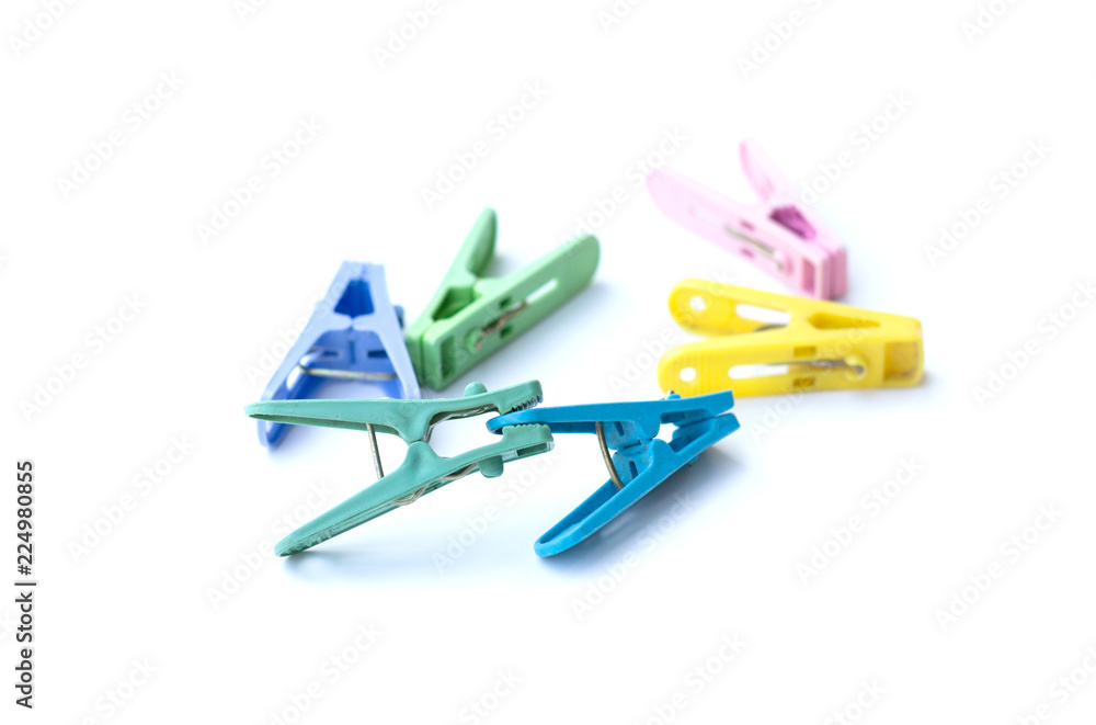 Pile of colorful clothespins isolated on white background Pile of colorful clothespins isolated on white background