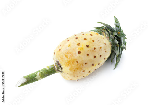 peeled pineapple and fresh ripe pineapple isolated on white background