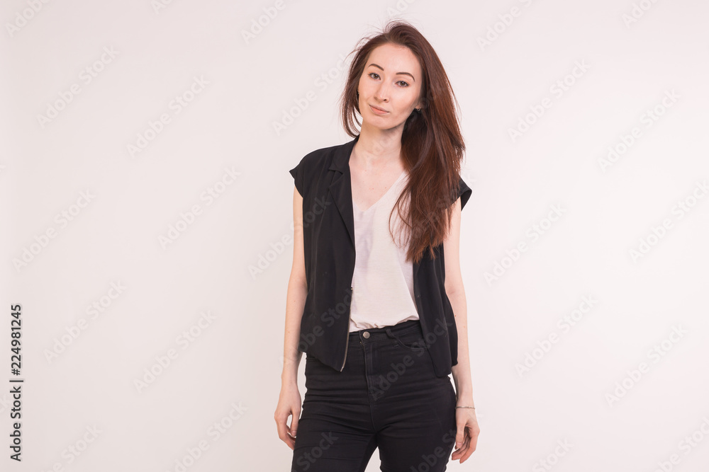 Fashionable young asian woman posing on white background with copy space Fashionable young asian woman posing on white background with copy space