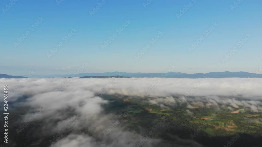 Landscape of Morning Mist with Mountain Layer at north of Thailand. Aerial View. Flying over the high mountains in beautiful clouds . Aerial video shot. Landscape of Morning Mist with Mountain Layer at north of Thailand. Aerial View. Flying over the high mountains in beautiful clouds . Aerial video shot.