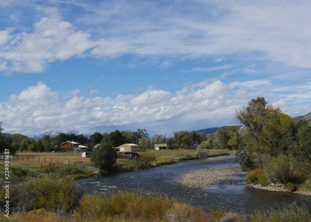 Scenic countryside view of a village by the Arkansas River in Wellsville, Colorado on a beautiful day