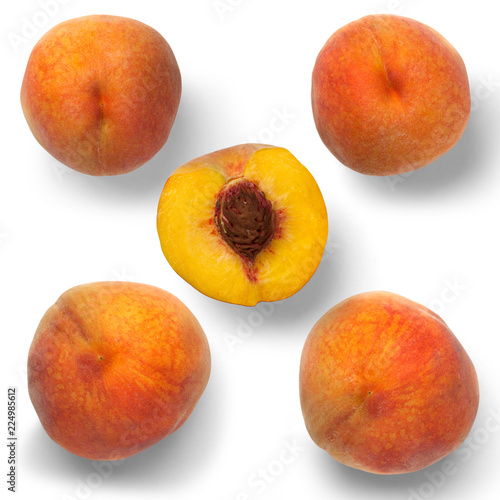 Four peaches and a half on a white background. View from above