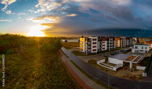 Obraz na płótnie View from above on real estates in Ostrow Wielkopolski in Poland, during dynamic weather. w salonie