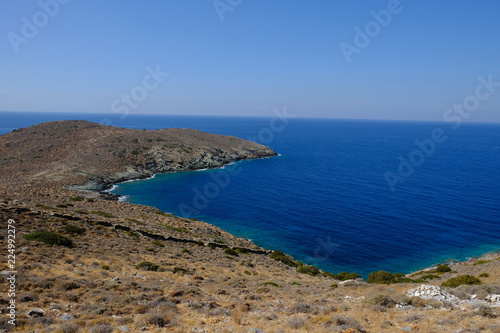 Island of Syros in greece, panorama of the kliff close to Delfini beach with land and sea.
