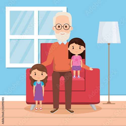 grandfather with granddaughters on livingroom