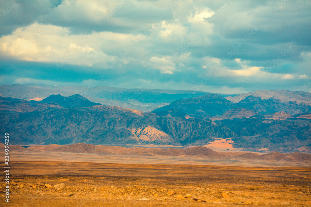 Desert with mountains on the horizon Desert with mountains on the horizon
