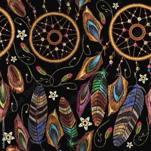 Embroidery dream catcher boho seamless pattern. Magic tribal feathers pattern, t-shirt design. Ethnic style. Native american indian talisman dream catcher. Fashionable template clothes