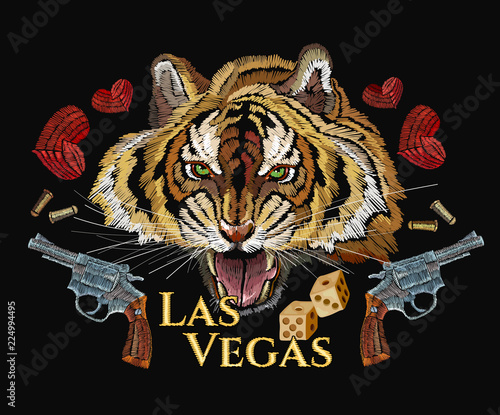 Fototapeta Naklejka Na Ścianę i Meble -  Wild west embroidery tiger head, heart and old revolvers. Las Vegas slogan. Casino art, western concept. Template for clothes, t-shirt design. Embroidery tiger and guns